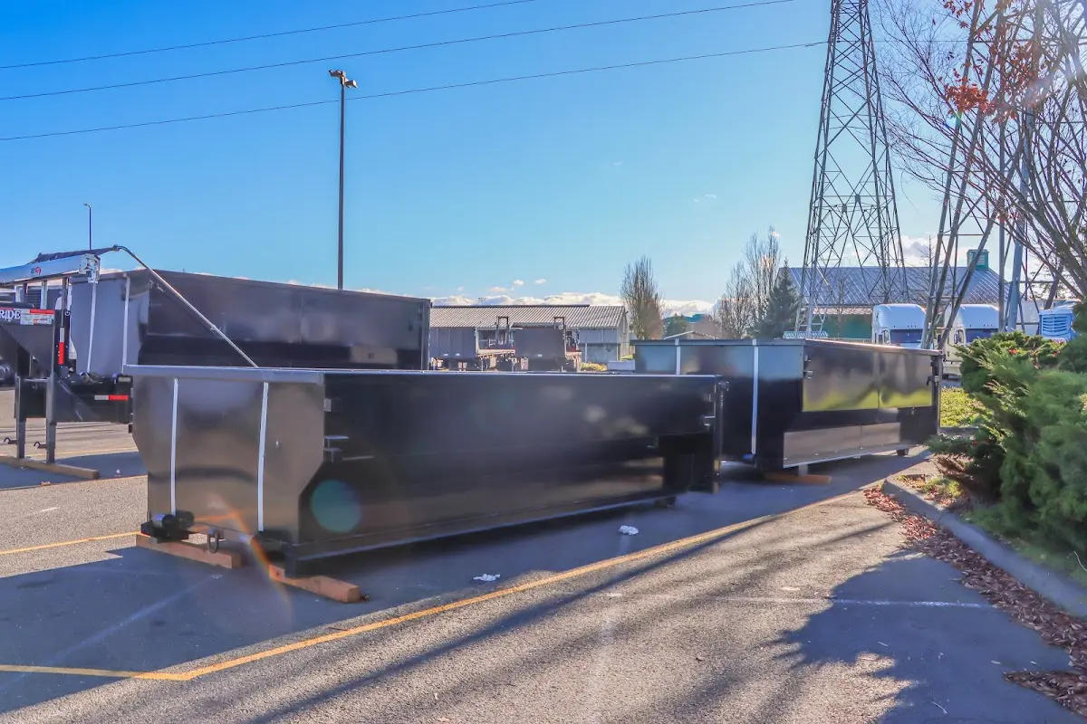 Roll-off dumpster ready for waste disposal at job site for Demolition Dumpster Rental in Owego